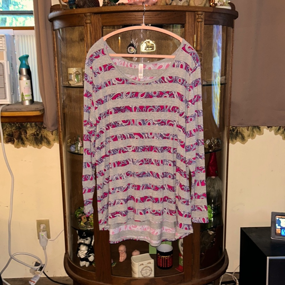 Lularoe long sleeved NWOT longer in the back.  paisley, flowers